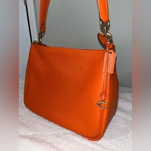 Pumpkin orange Coach purse